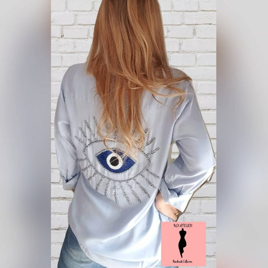 Camisa azul clara Olho grego